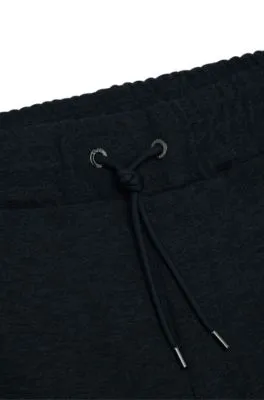 Regular-fit tracksuit bottoms in stretch flannel